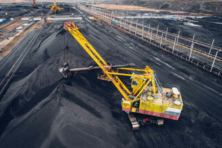 Coal mining at an open pit from above.