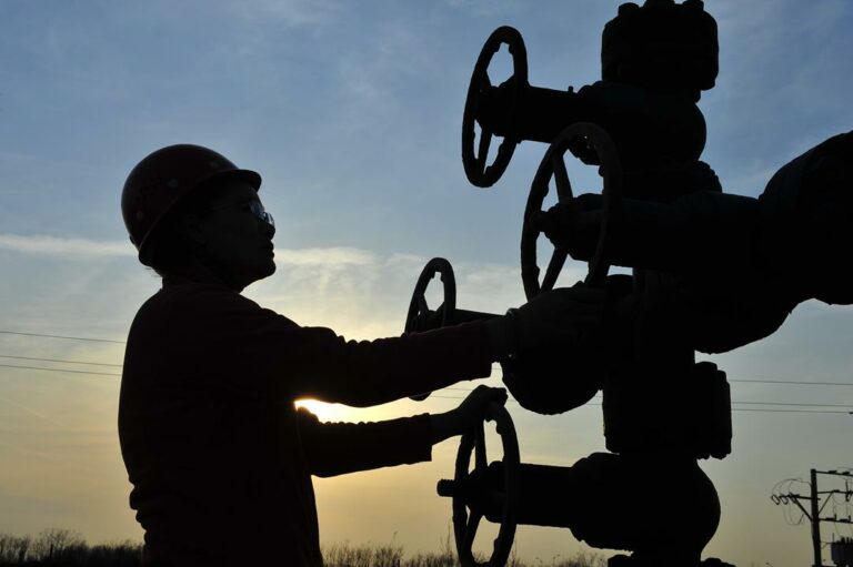 Oil field oil workers at work