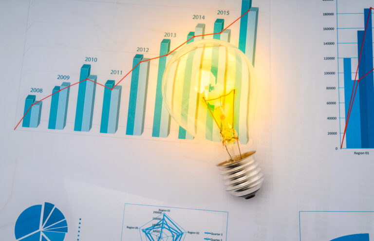 Light bulb with business graph .