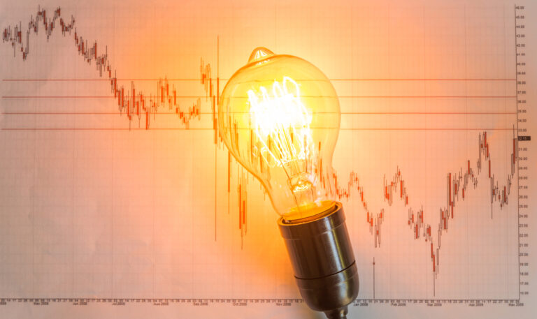 Light bulb with business graph