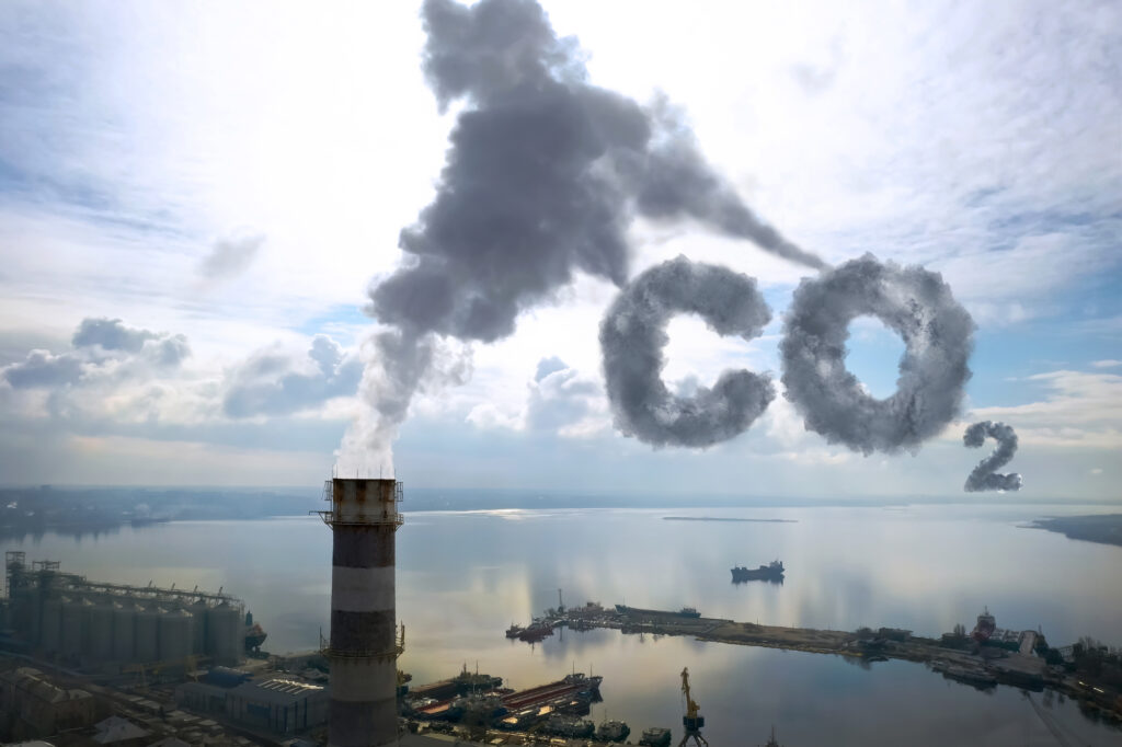 Polluting air with smoke, aerial view of industrial factory. CO2