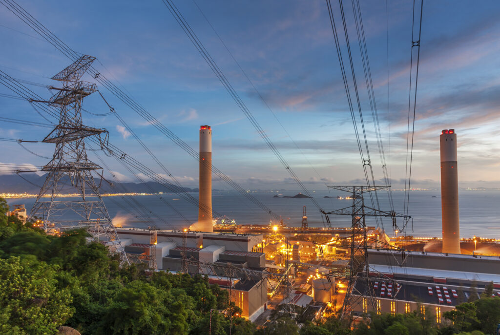 Power plant and electric pylon at dusk