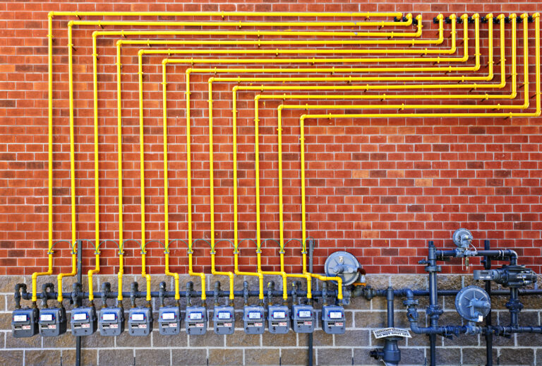 Gas meters on brick wall