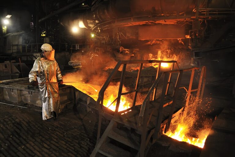 Molten hot steel pouring and worker