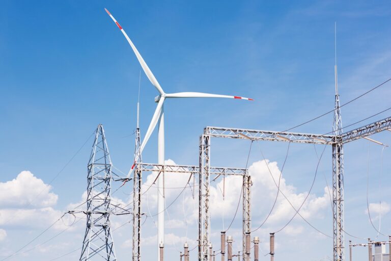 turbogenerator and powerplant close up, against a blue sky with clouds, farm energy complex