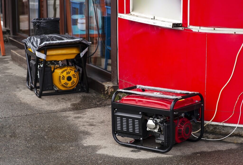 Portable electric generator running in the cold winter Energy genocide  Power outage as a result of missile strikes by Russia on energy facilities of Ukraine  Small business use gasoline generators