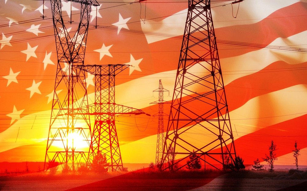 High-voltage power transmission line. Energy pillars. At sunset,