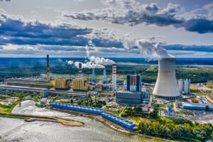 Power station under moody cloudy sky aerial view