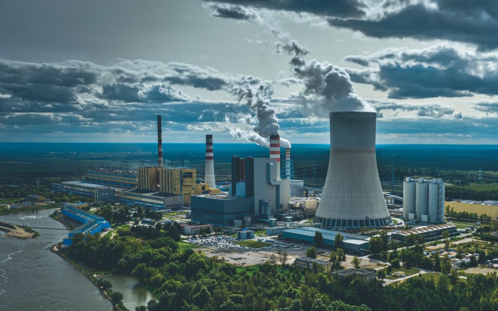 Power station under moody cloudy sky aerial view